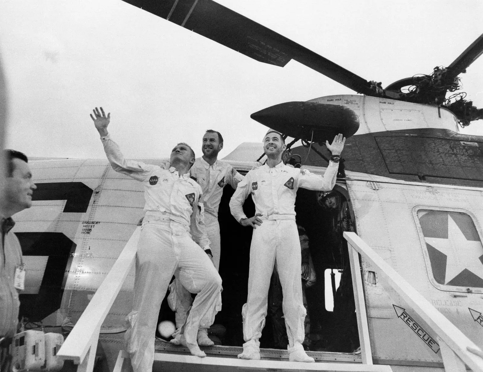 Borman, Lovell and Anders step off the recovery helicopter onto the carrier USS Yorktown, 27 December 1968 (S69-15737)