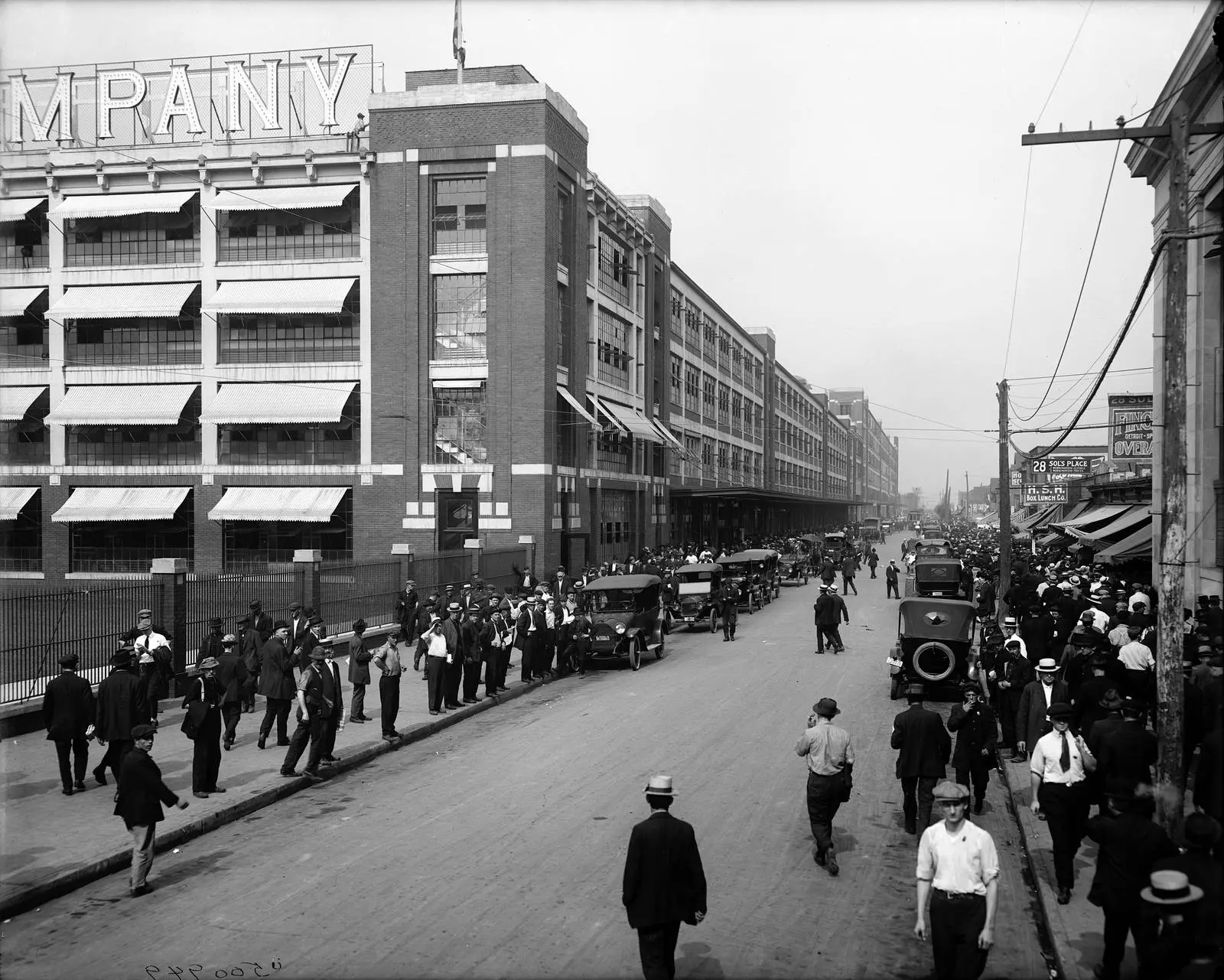 Shift change at the Ford Motor Company plant, 1910s.