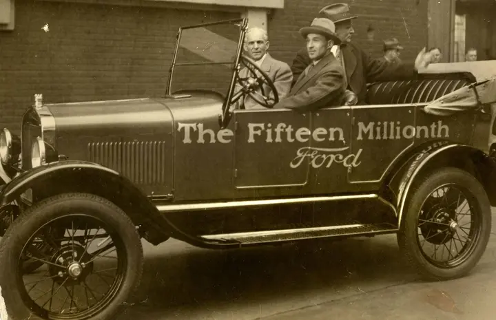 Henry Ford at the wheel of the fifteen millionth Model T, with Edsel Ford beside him, 26 May 1927.