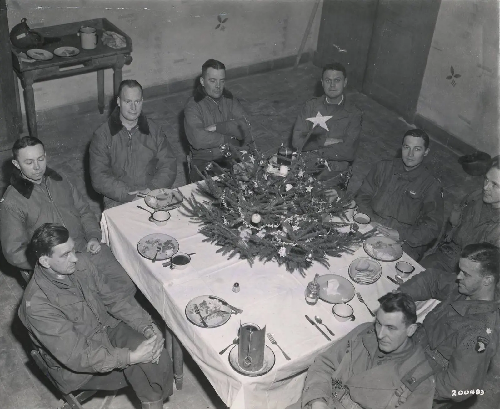 Brig. Gen. Anthony McAuliffe and his staff at Christmas dinner in the Heintz Barracks, Bastogne, 25 December 1944