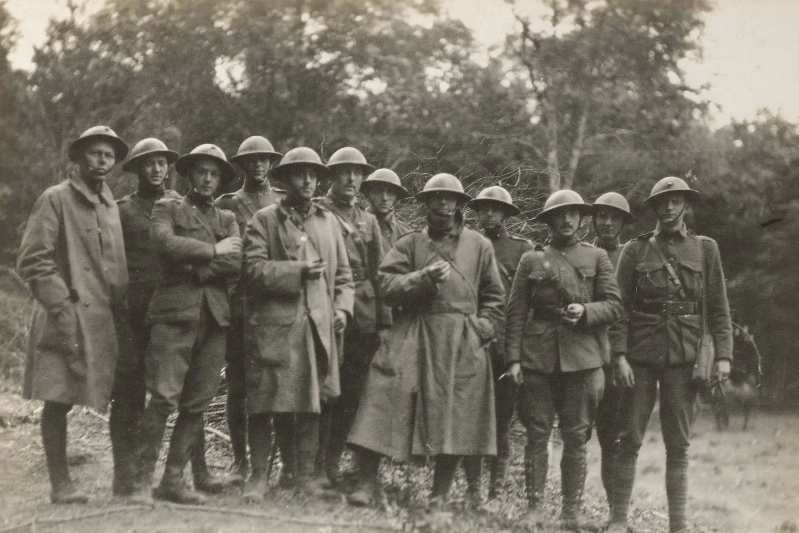Surviving officers of the 2nd Battalion, 6th Marines head for a rest camp, 18 June 1918. Maj. Thomas Holcomb and Lt. Clifton Cates, both future Commandants, stand among them
