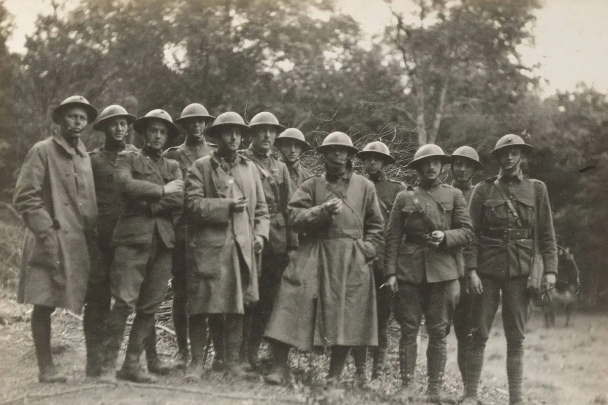 Surviving officers of the 2nd Battalion, 6th Marines head for a rest camp, 18 June 1918. Maj. Thomas Holcomb and Lt. Clifton Cates, both future Commandants, stand among them