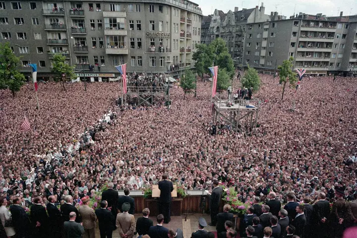 President Kennedy speaks from the steps of Rathaus Schöneberg to a packed Rudolph Wilde Platz, West Berlin, 26 June 1963