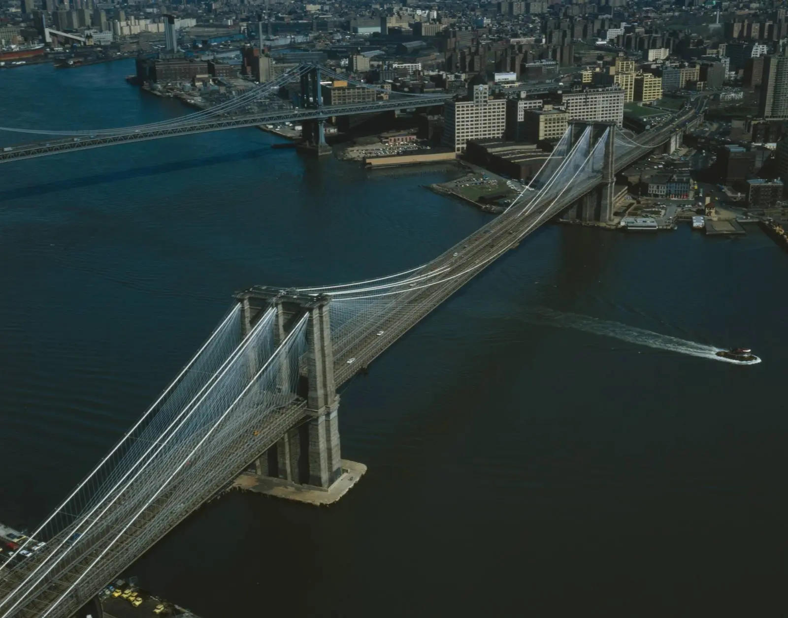 The bridge from the air, looking east toward Brooklyn, with the Manhattan Bridge upriver, 1982.