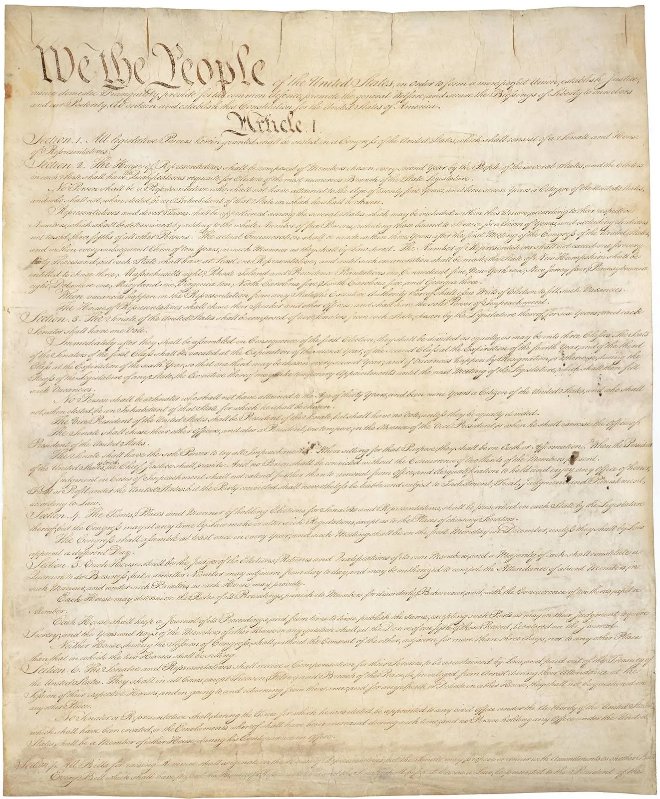Page one of the signed Constitution, opening with the words We the People.