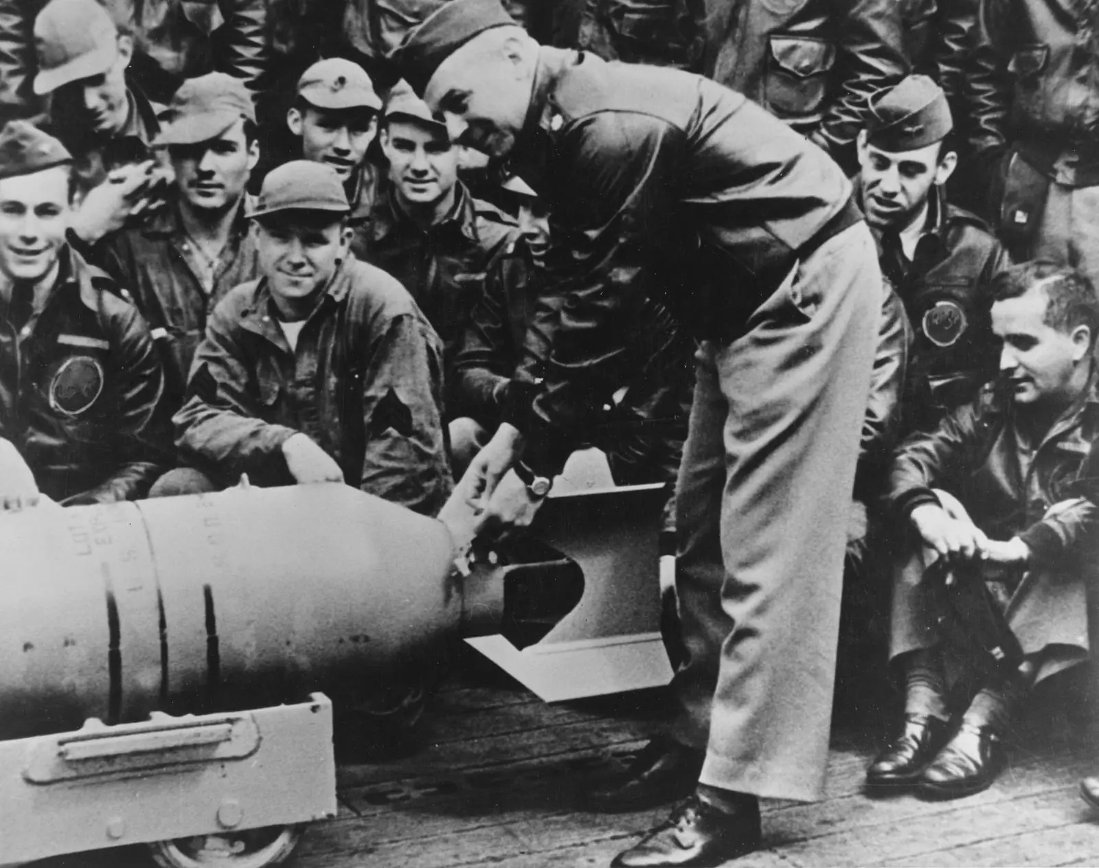 Doolittle wires a Japanese medal to a 500-pound bomb on Hornet’s flight deck, to be returned to Japan (80-G-41191).