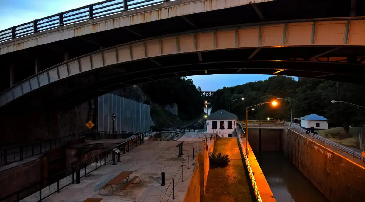 Lockport at dusk: the old Flight of Five, left, beside the modern locks that still lift boats up the escarpment, July 2016