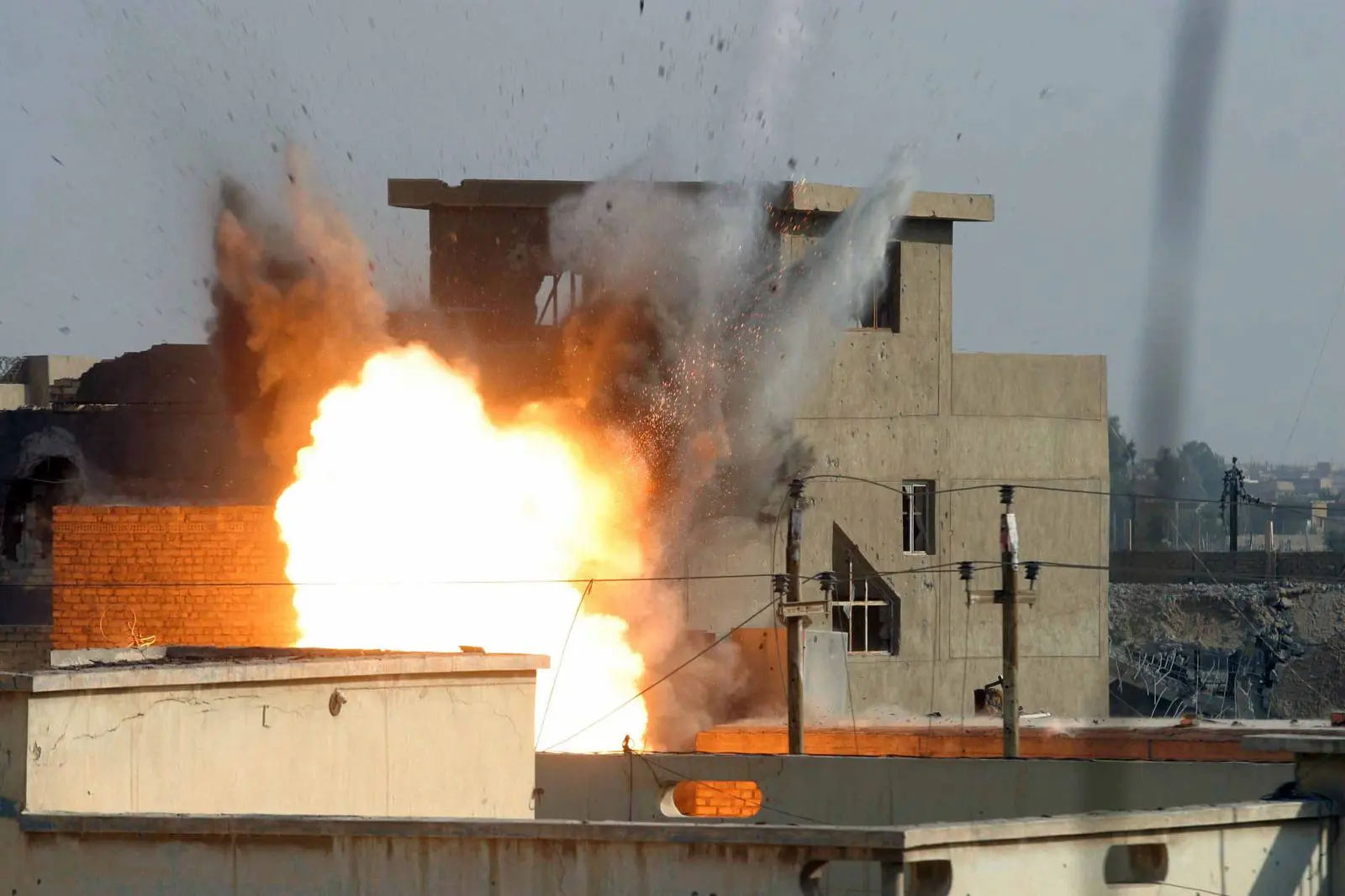 A precision air strike destroys an insurgent stronghold as 3d Battalion, 1st Marines, pushes through Fallujah, 10 November 2004.