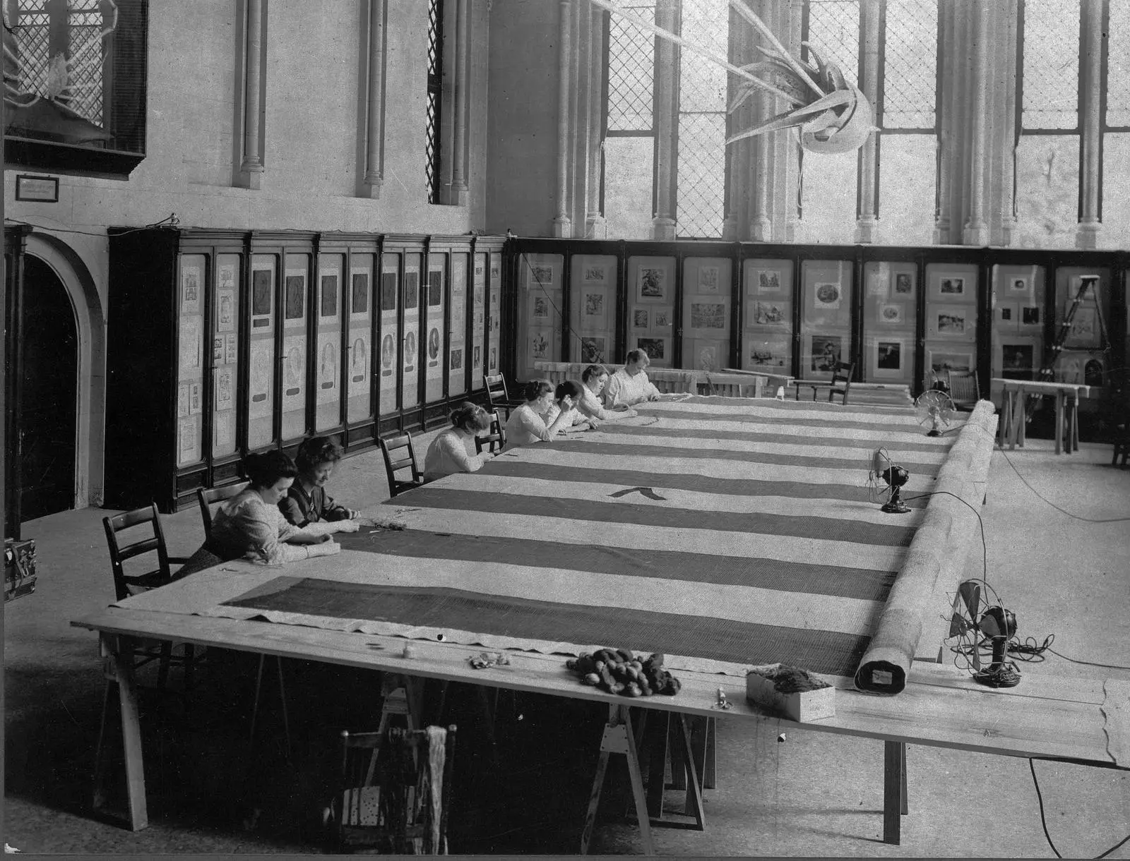Amelia Fowler’s team of needlewomen stitches the flag to a linen backing at the Smithsonian, 1914.