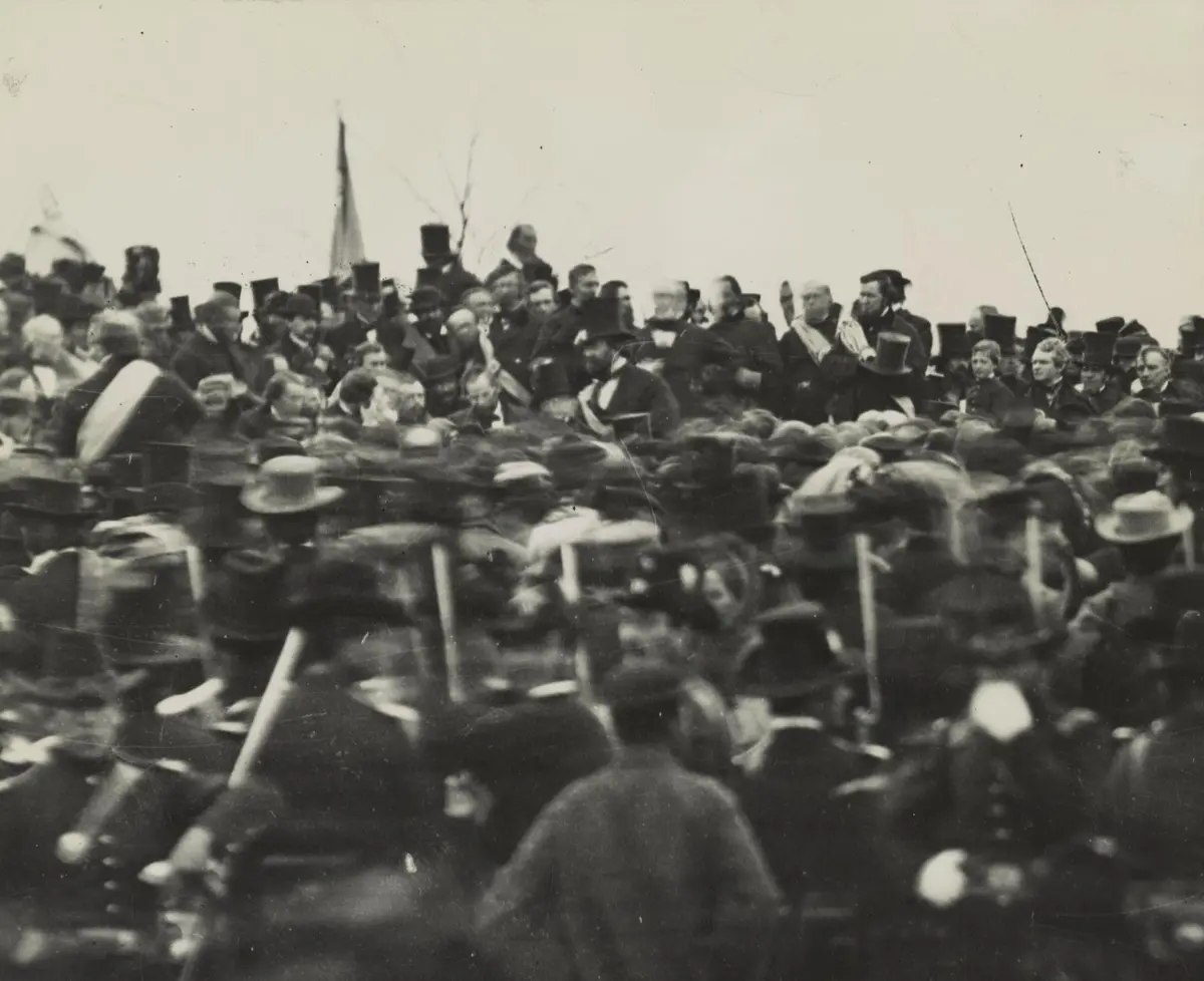 Lincoln, bareheaded near the center, sits among the dignitaries on the platform at Gettysburg about noon on 19 November 1863. Archivist Josephine Cobb found him in this plate in 1952.