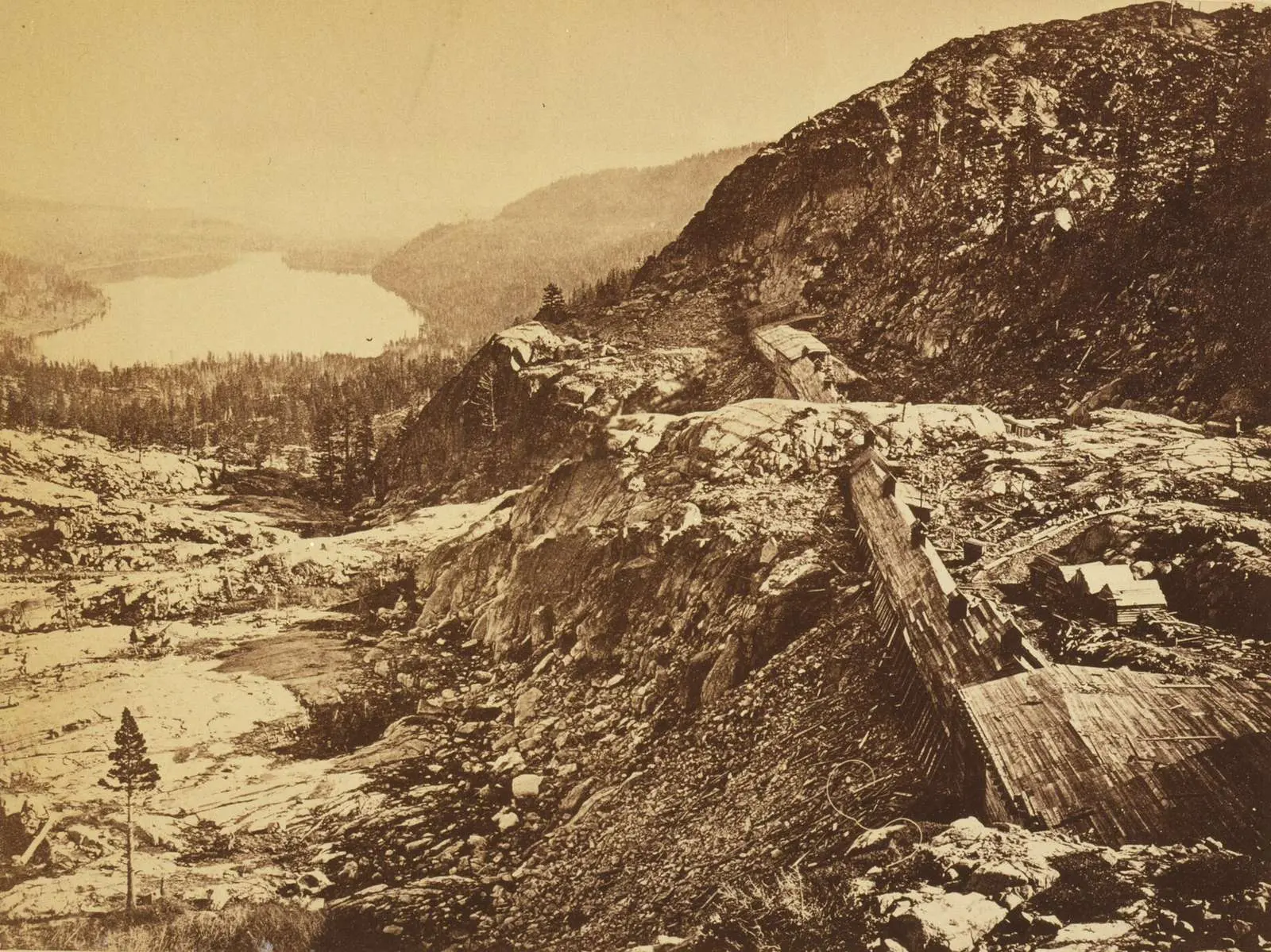 Summit of the Sierra Nevada: Central Pacific snow sheds in the foreground, Donner Lake below