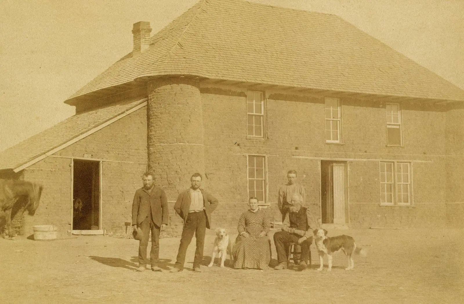 Isadore Haumont and family before their two-story sod house on French Table, north of Broken Bow, Nebraska, in 1886.