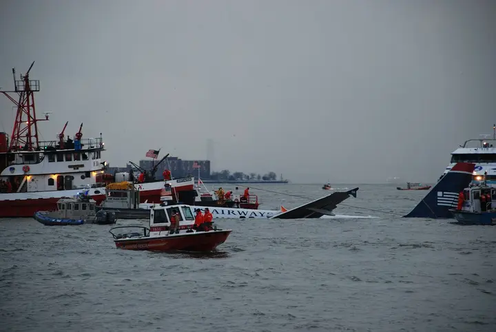 FDNY fireboats, police launches and ferries close around the Airbus as rescuers secure it in the Hudson, 15 January 2009
