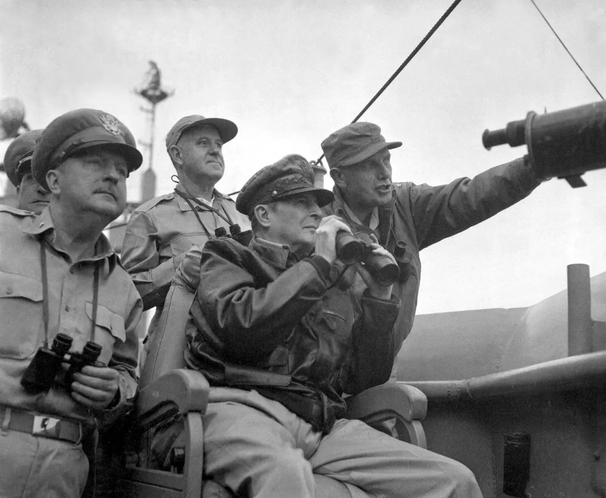 Gen. Douglas MacArthur watches the bombardment of Inchon from USS Mount McKinley with Brig. Gen. Courtney Whitney and Maj. Gen. Edward Almond, 15 September 1950.