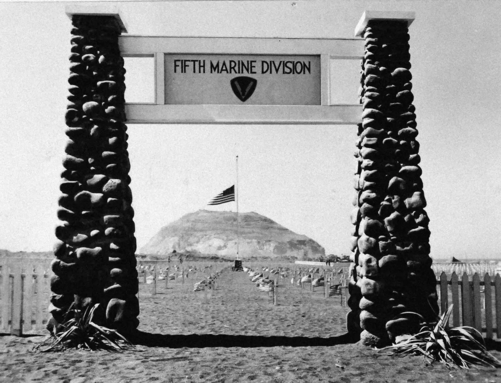 Entrance to the 5th Marine Division Cemetery, with Mount Suribachi beyond, Iwo Jima, 1945 (127-GW-305-145467)