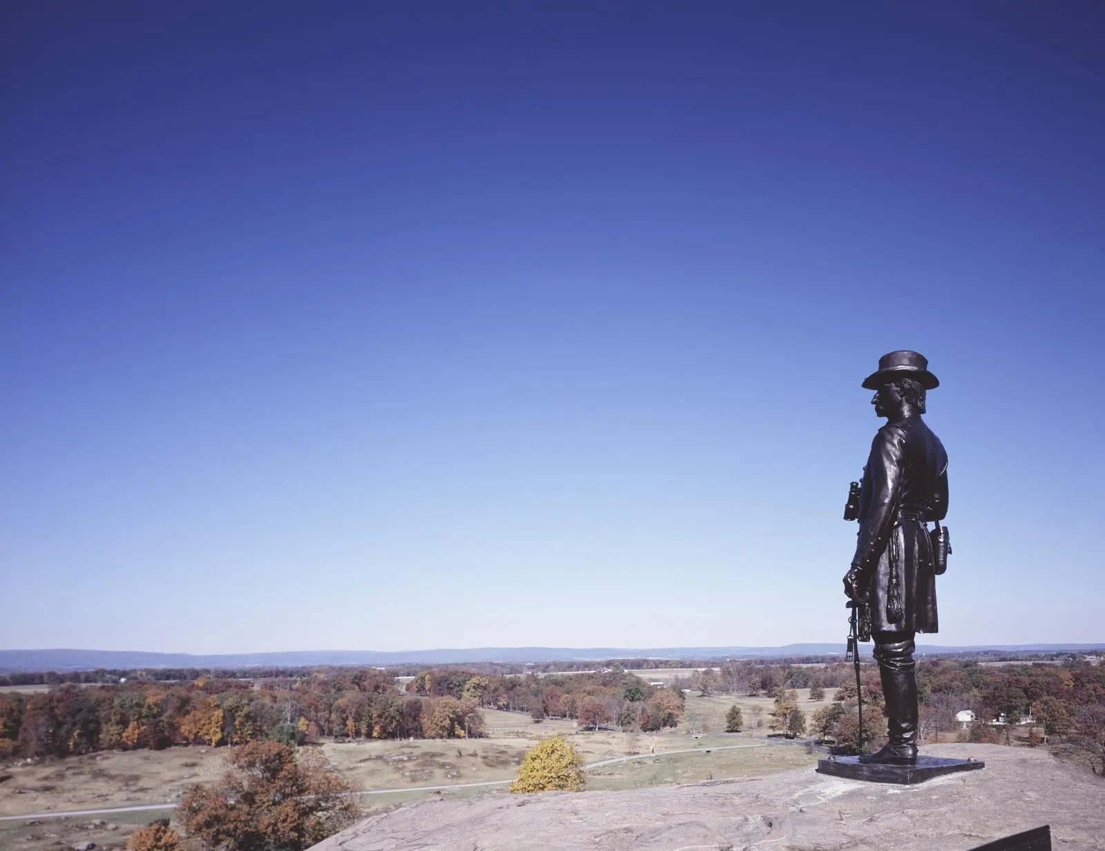 Gen. Gouverneur K. Warren's bronze statue stands on the rock where he spotted the danger, looking west over the ground the Confederates crossed.