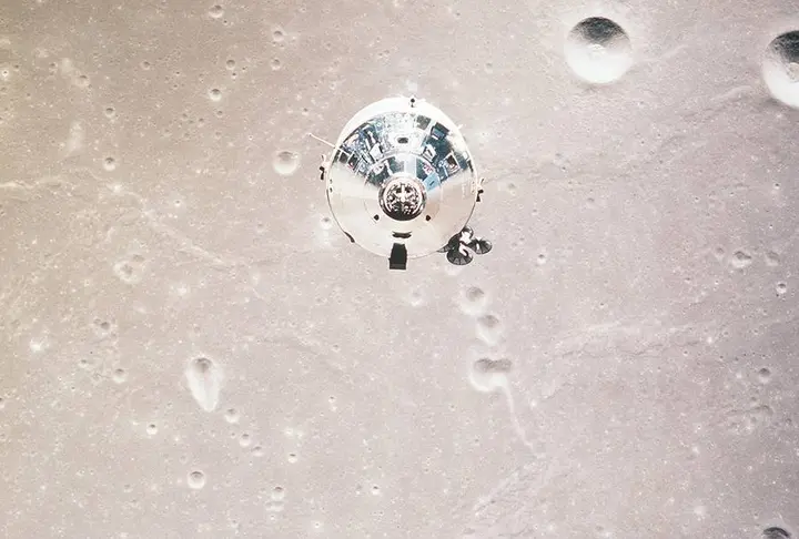 Command Module Columbia over the Moon, photographed from Eagle, July 20, 1969 (AS11-37-5445)