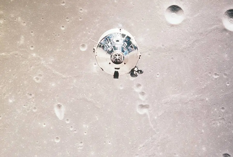 Command Module Columbia over the Moon, photographed from Eagle, July 20, 1969 (AS11-37-5445)