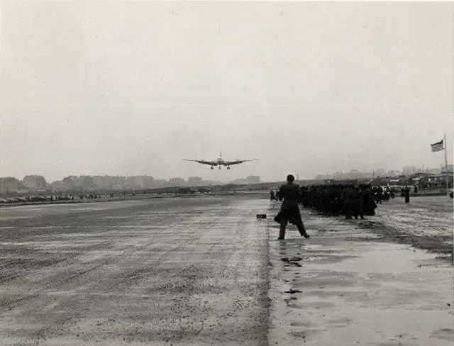 The first C-54 comes in to land at the new Tegel airfield during its opening ceremony, 5 November 1948.