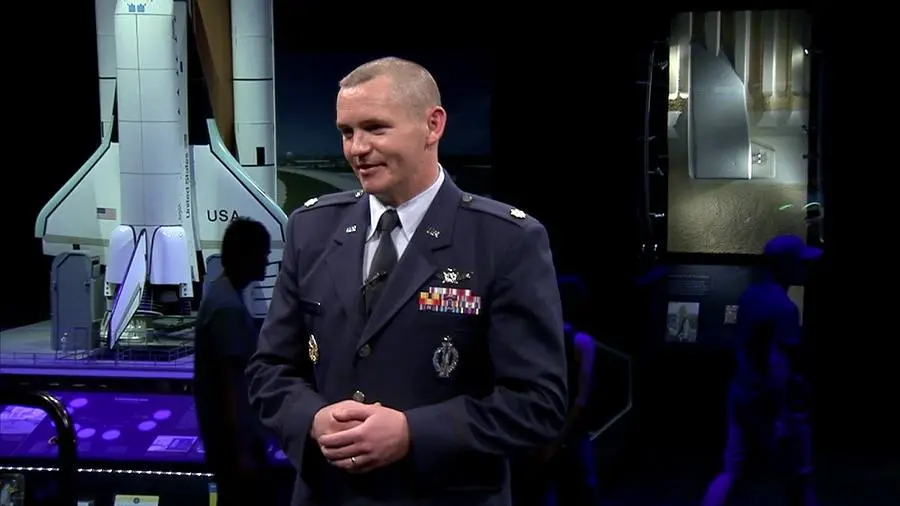 An Air Force officer speaks on GPS at the Smithsonian's National Air and Space Museum.