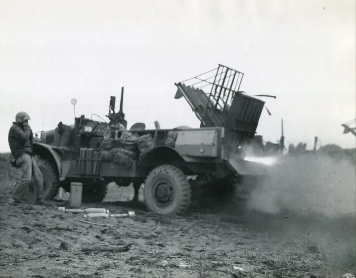 A Marine rocket truck fires a barrage at Japanese positions on Iwo Jima, 1945