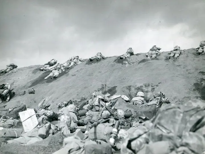 5th Marine Division Marines work up the terraces from Red Beach One, 19 February 1945