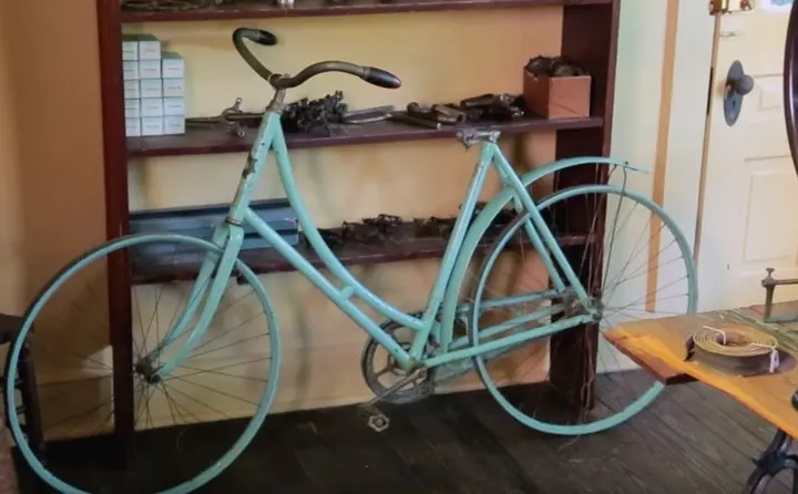 A period bicycle inside the Wright Cycle Company building, now at Greenfield Village, Dearborn, Mich.