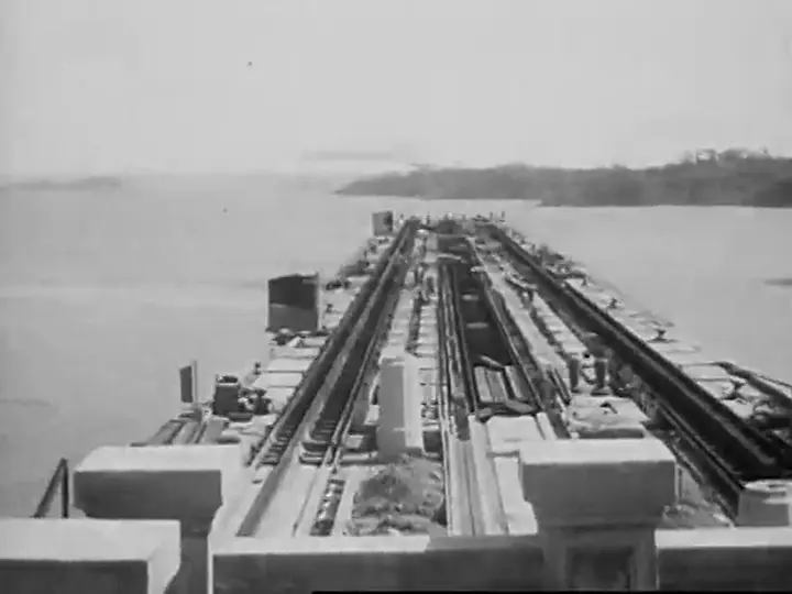 Frame from a silent Duhem Motion Picture film of the Panama Canal: a lock wall reaching out into the water