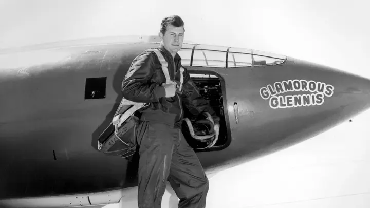 Capt. Chuck Yeager stands beside the Bell X-1 #46-062 "Glamorous Glennis," named for his wife.
