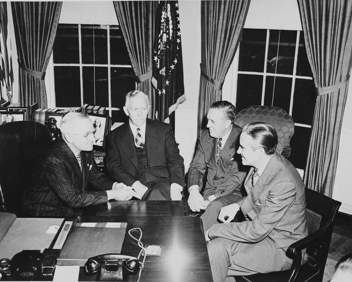 President Truman, George C. Marshall, Paul Hoffman and Averell Harriman discuss the Marshall Plan in the Oval Office, 29 November 1948.