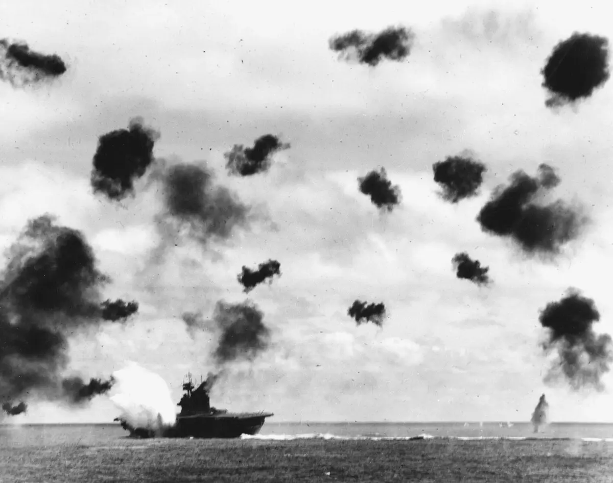 USS Yorktown takes a torpedo amidships on her port side during the afternoon attack by Hiryu's torpedo planes, 4 June 1942 (80-G-414423).