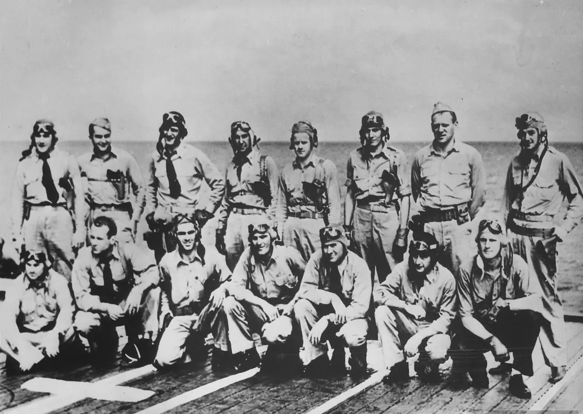 The pilots of Torpedo Squadron 8 aboard USS Hornet in May 1942: Lt. Cmdr. John Waldron stands third from left, and Ens. George Gay, the only one to survive the attack, kneels fourth from left (NH 93595).