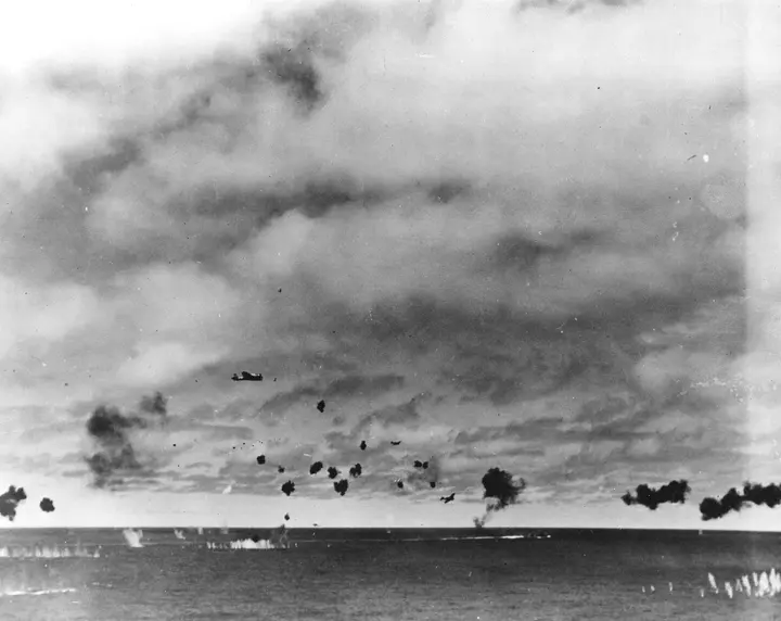 Hiryu's torpedo planes run in through a sky full of antiaircraft fire as they attack Yorktown, 4 June 1942 (80-G-11639).