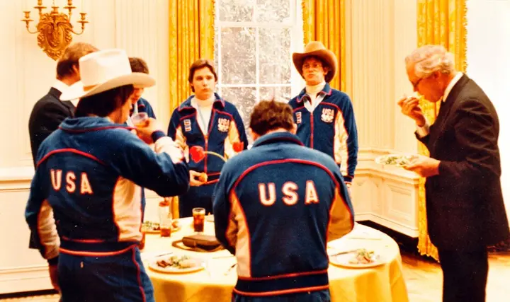 Members of the gold-medal hockey team in their USA jackets at the White House reception in the State Dining Room, 25 February 1980