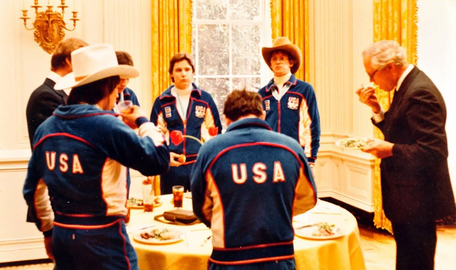 Members of the gold-medal hockey team in their USA jackets at the White House reception in the State Dining Room, 25 February 1980