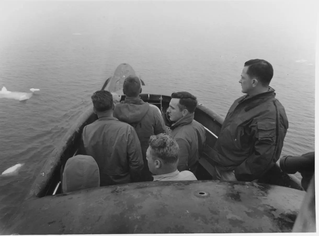 Cmdr. William Anderson (right) on the bridge among drifting ice as Nautilus prepares to pass under the North Pole, August 1958.