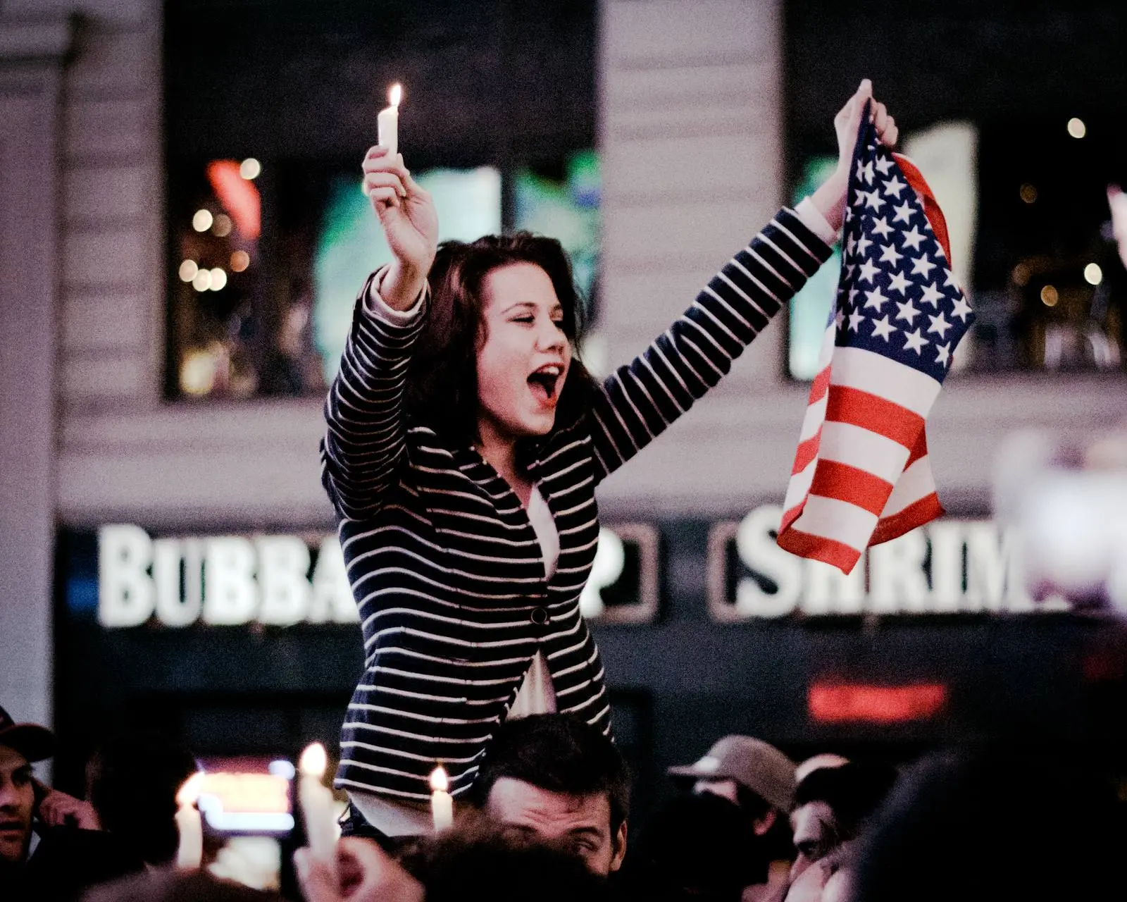 Candles and the flag in Times Square, New York, in the early hours of 2 May 2011