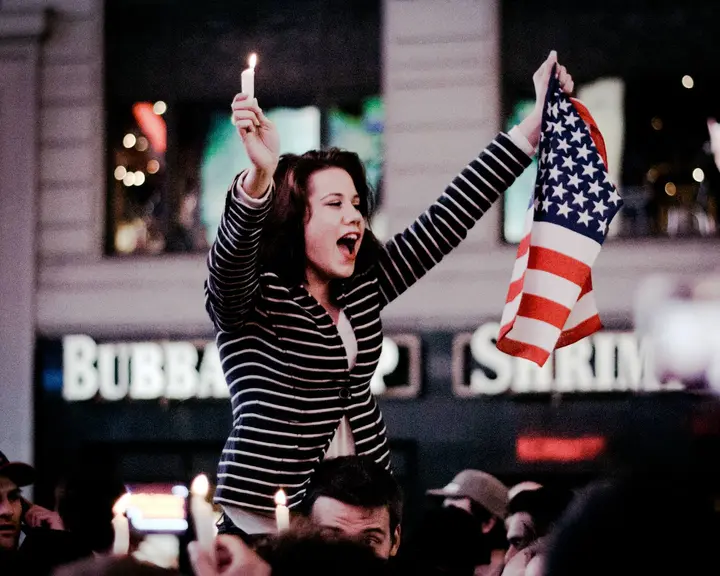 Candles and the flag in Times Square, New York, in the early hours of 2 May 2011