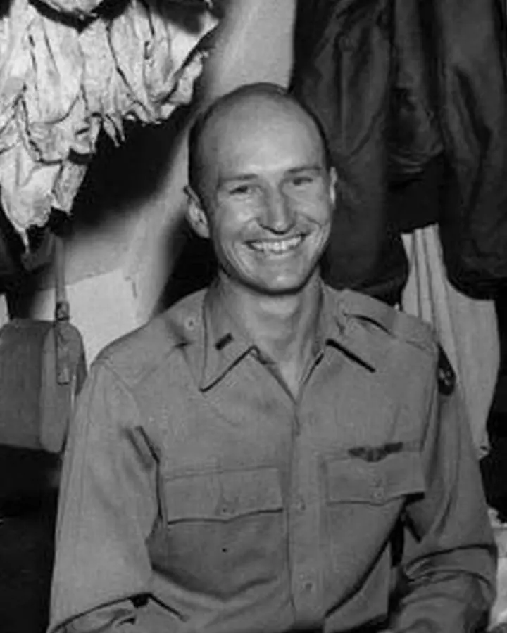 1st Lt. Gail S. Halvorsen in his quarters, rigging candy bars to handkerchief parachutes, 1948.