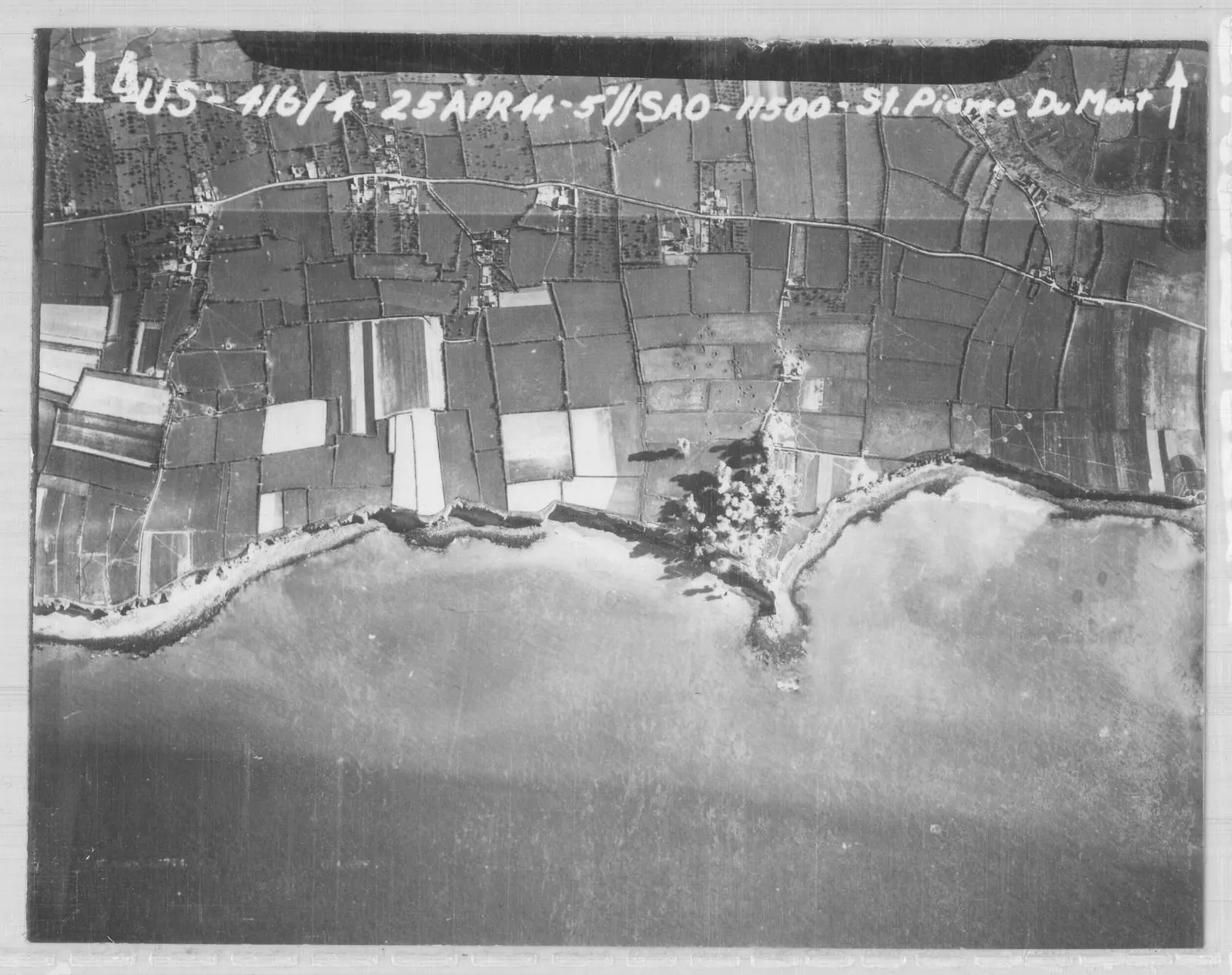 Ninth Air Force A-20 Havocs strike the gun positions on Pointe du Hoc on 25 April 1944, six weeks before the Rangers went up the cliff.