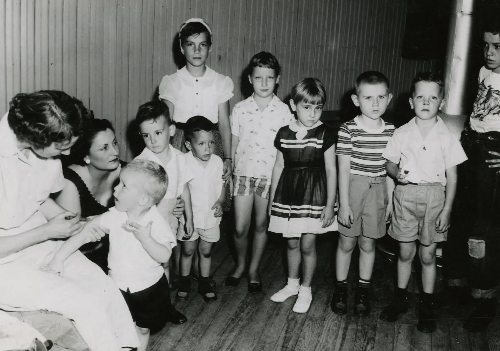 Children line up for their polio shots at a Mississippi clinic, 1956.