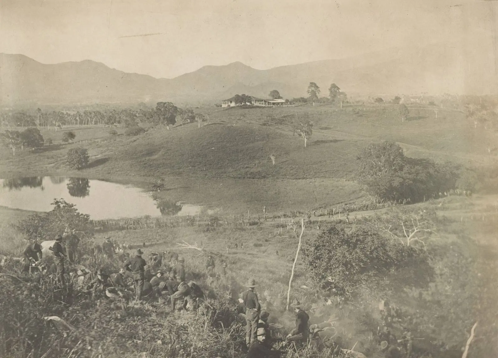 The hill from which the dismounted cavalry division charged the San Juan Heights, with the lagoon below and the mountains behind Santiago, 1898