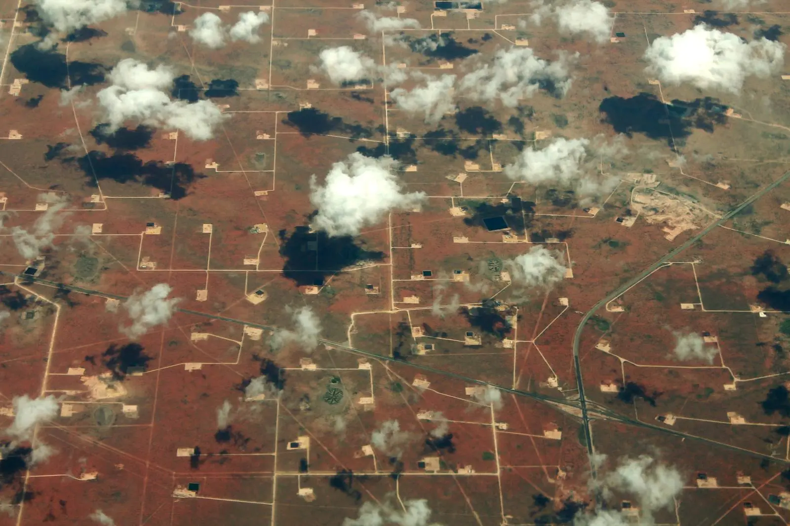 Well pads and roads spread across the Permian Basin near Midland, Texas, like a circuit board, 2014