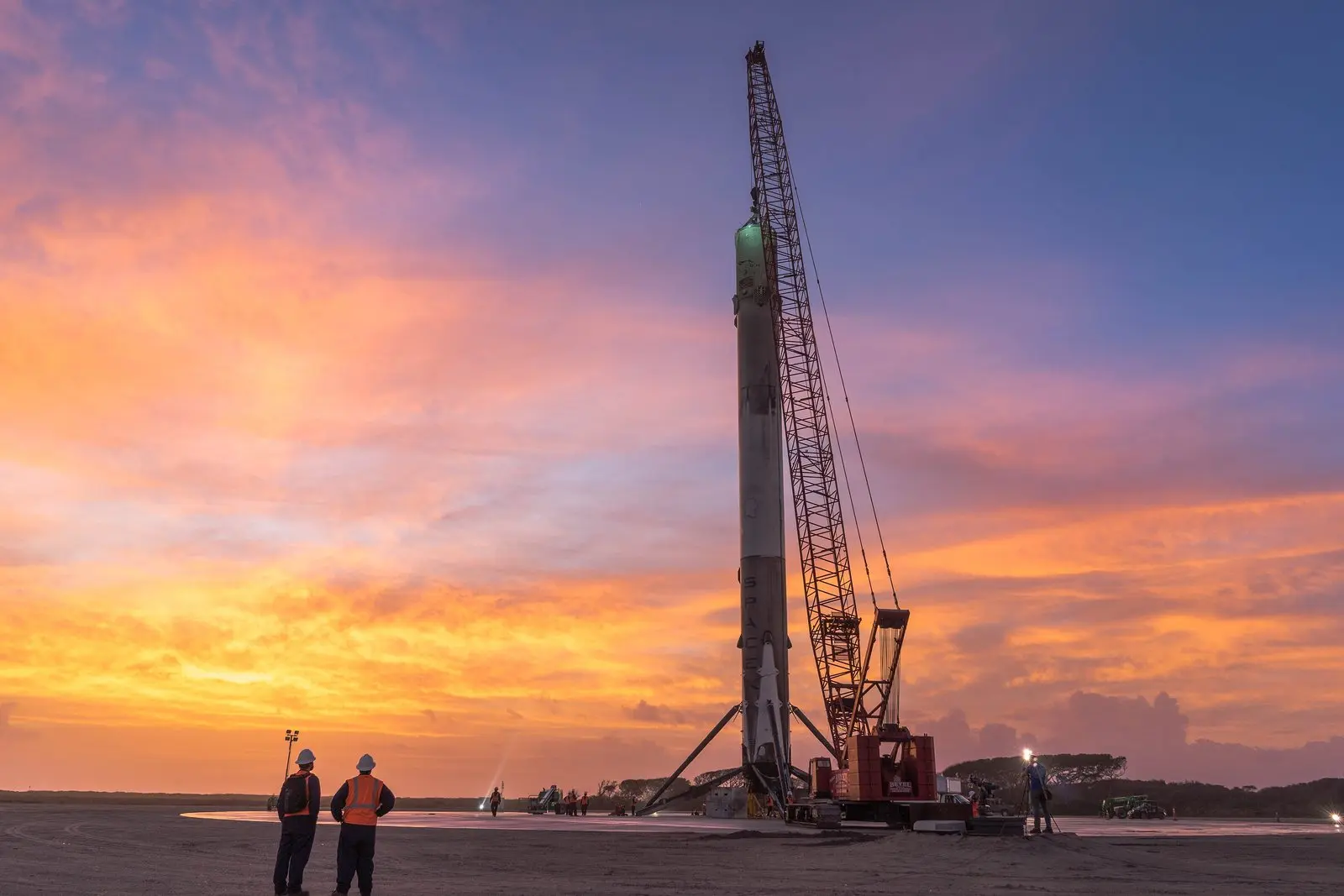 The first orbital booster ever to land stands upright on Landing Zone 1 after its return, December 2015.
