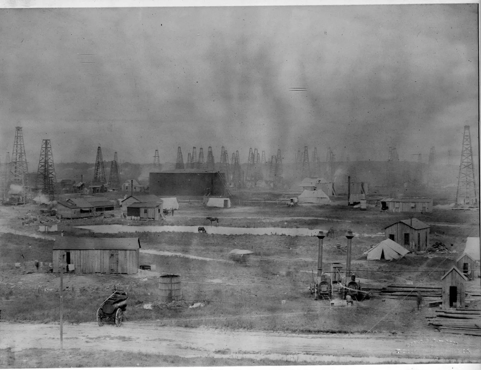 Shacks, tents and boilers of the boomtown camp spread across Spindletop Hill, 1901