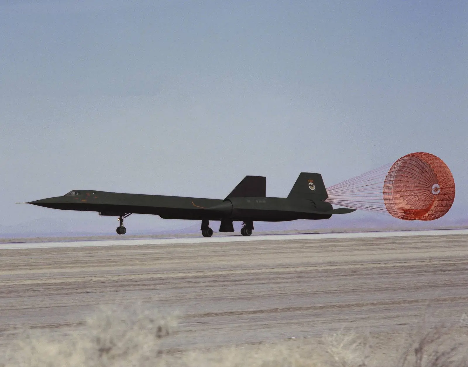 An SR-71A rolls out under its drag chute at NASA's Dryden Flight Research Center, Edwards, California.