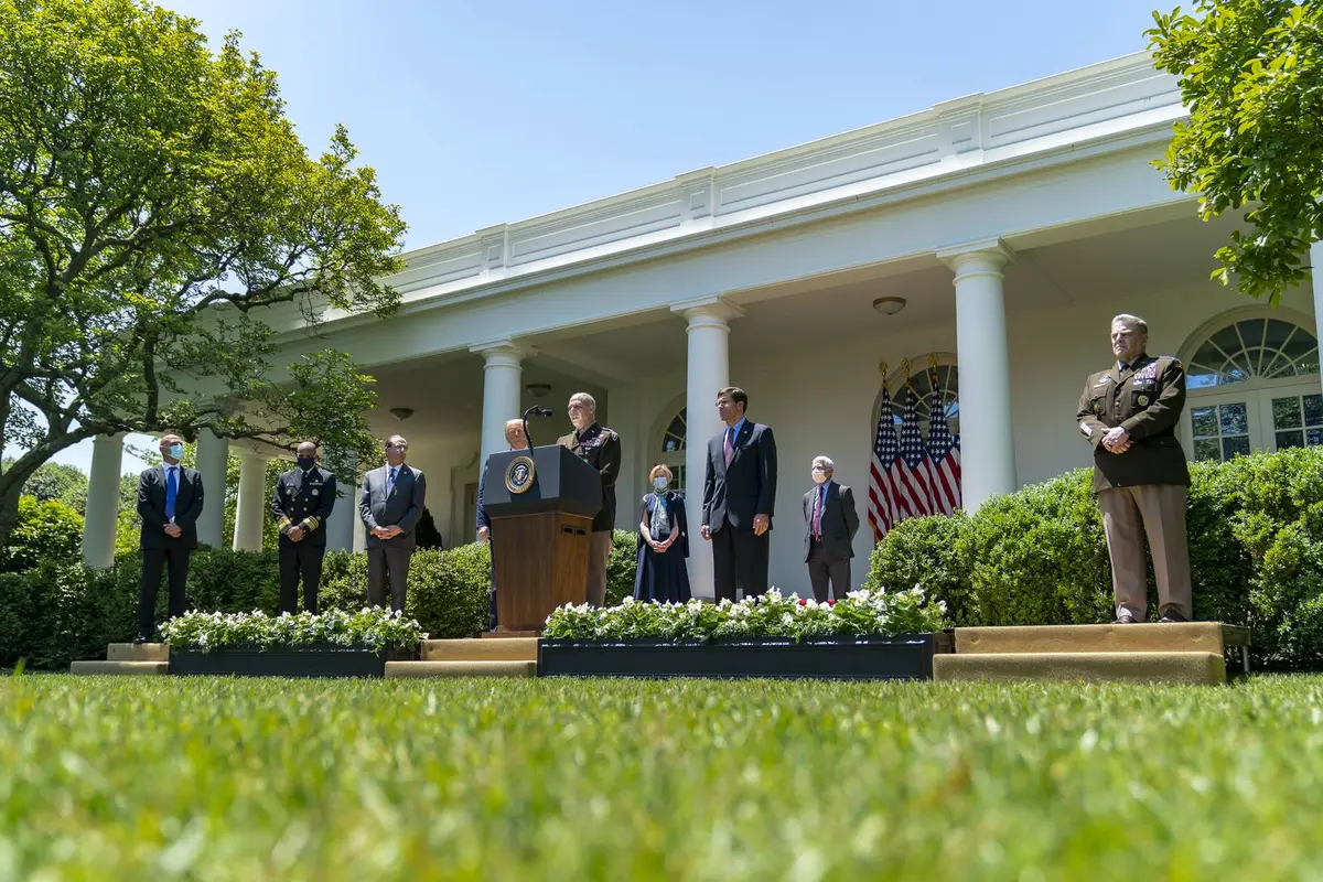 Gen. Gustave Perna, in uniform at right, stands in the Rose Garden as Operation Warp Speed is launched, 15 May 2020.