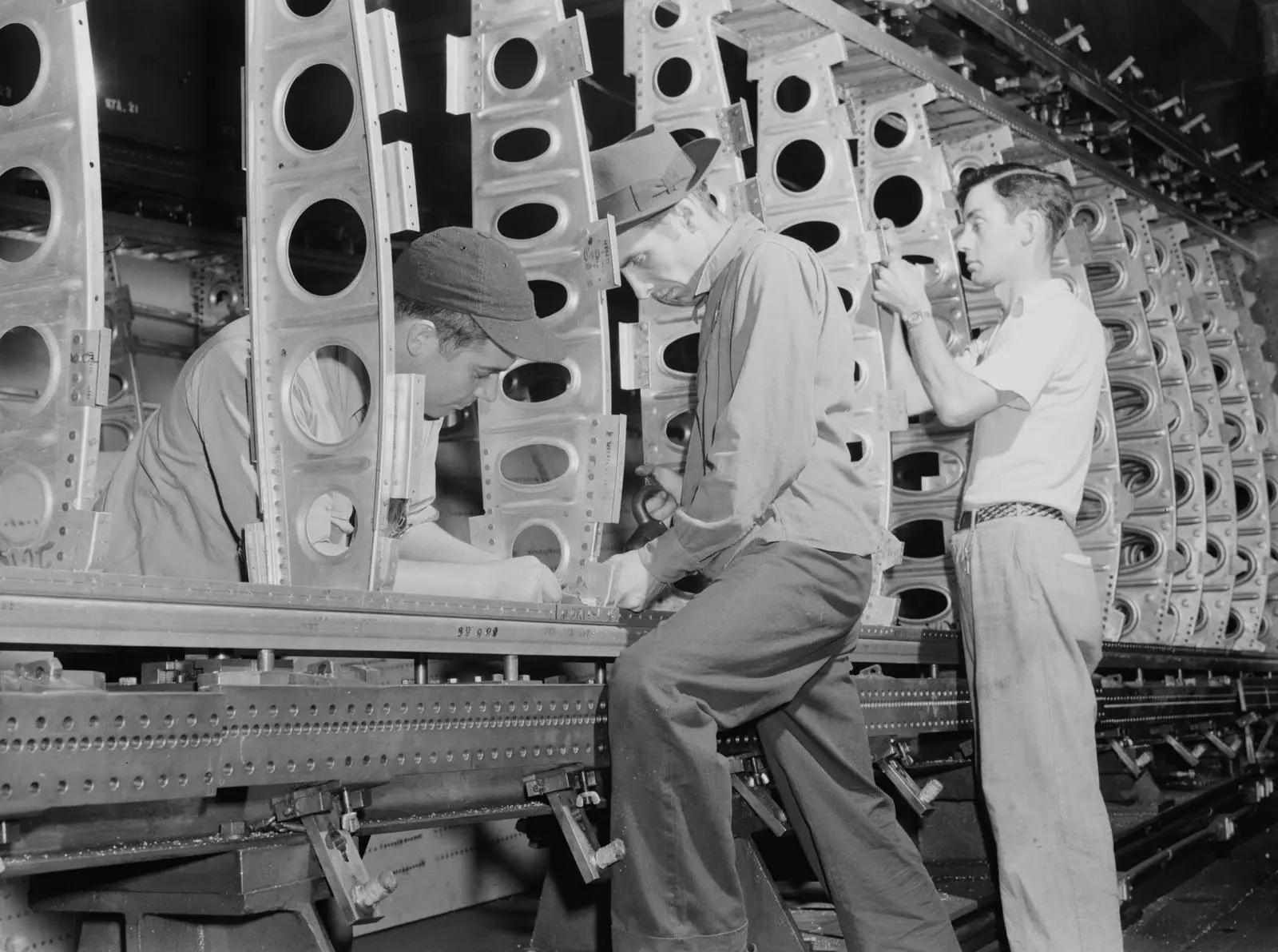 The outer wing panel of a bomber takes shape in its assembly fixture at Willow Run, July 1942